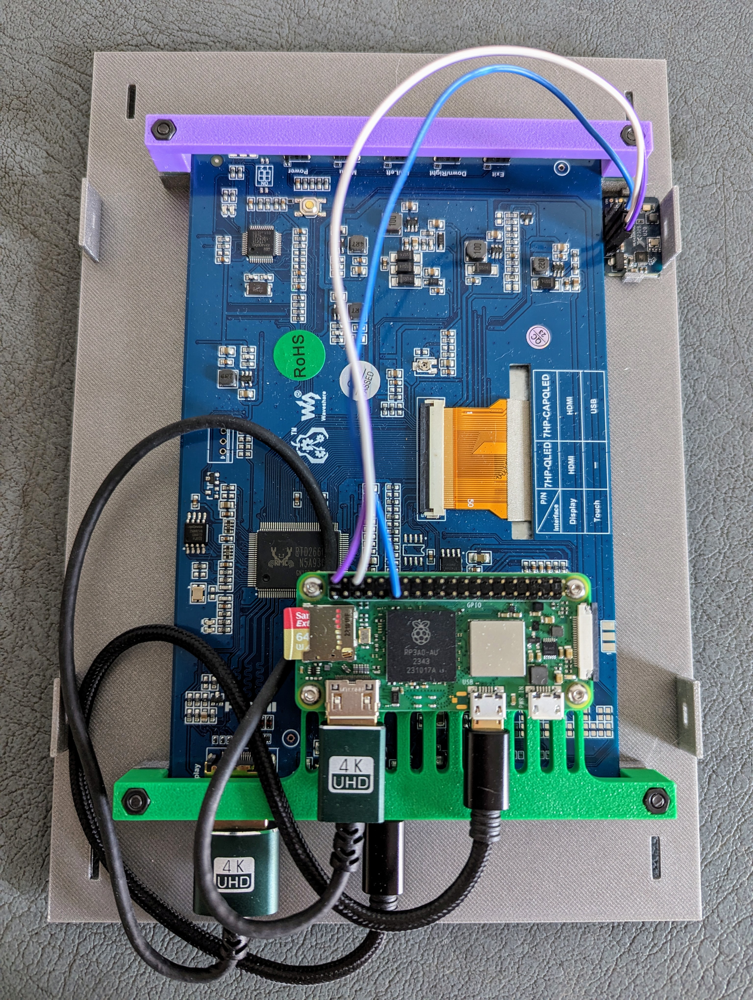 Inside of a DYI digital photo frame lying on a cupboard.